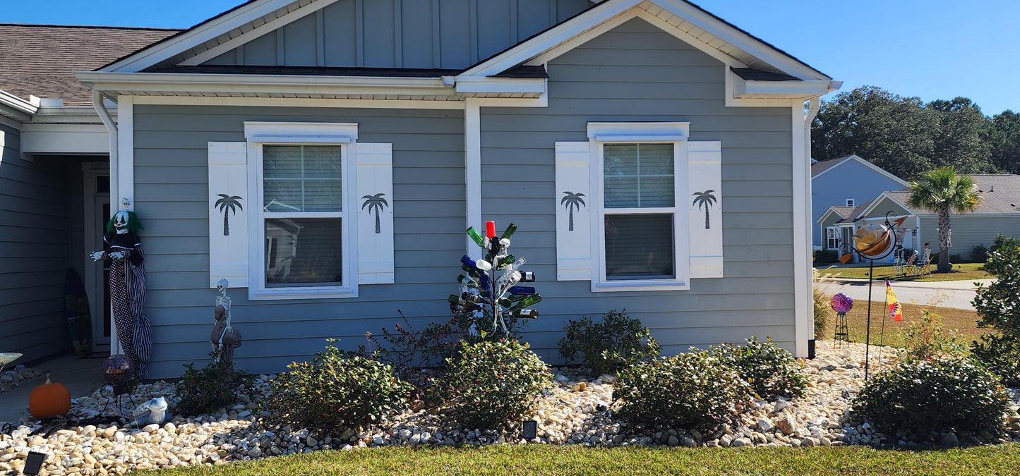 Gray house with decorative shutters in a residential area